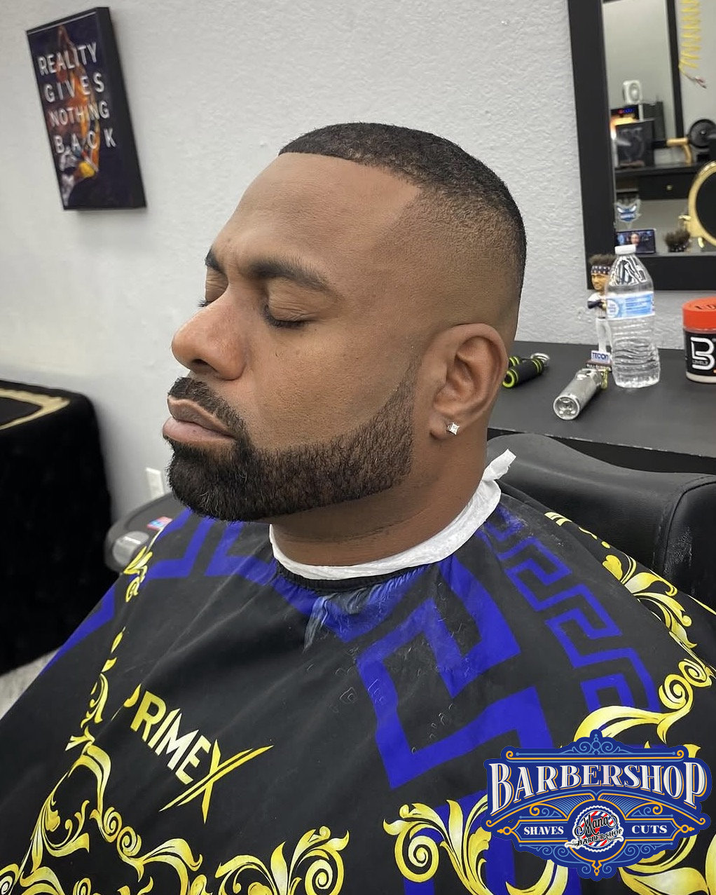 Sharp beard line-up and fade at Mana Barbershop